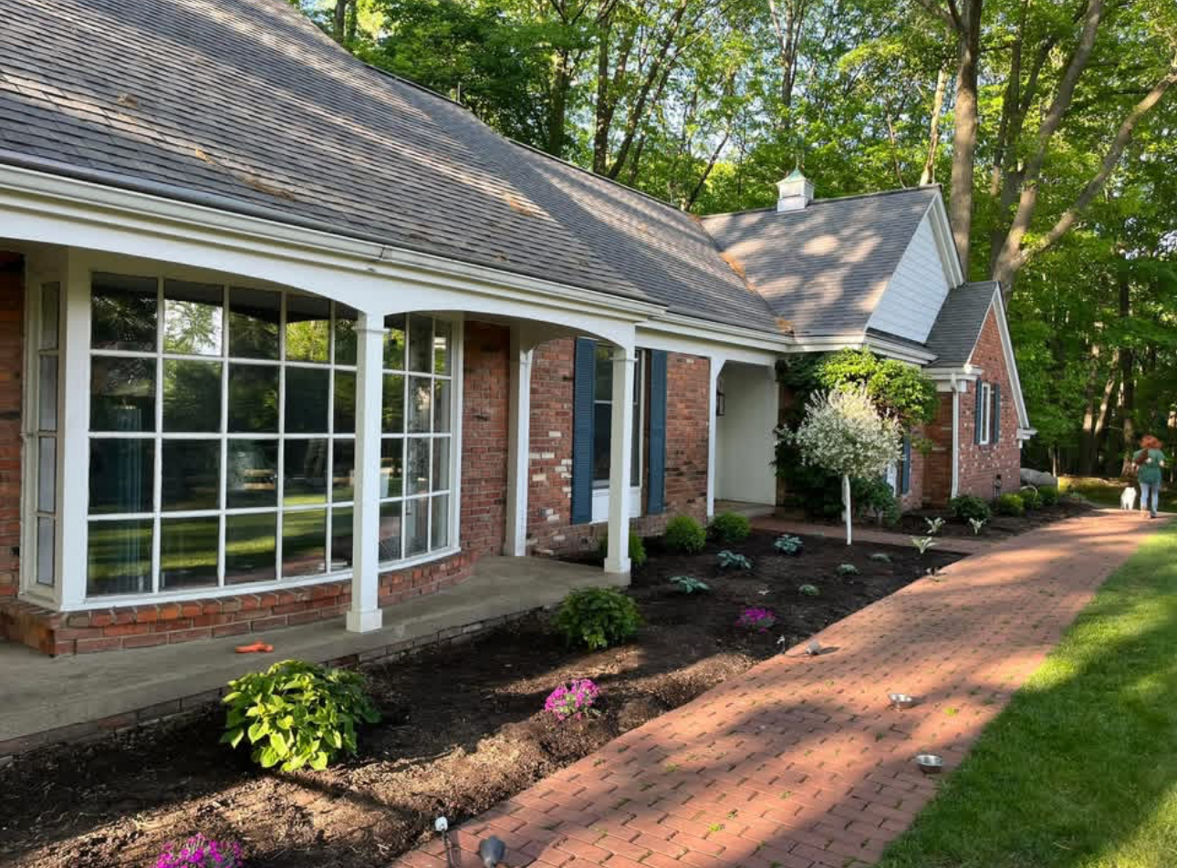 Brick home with paver walkway and landscaped beds in South Russell, Ohio