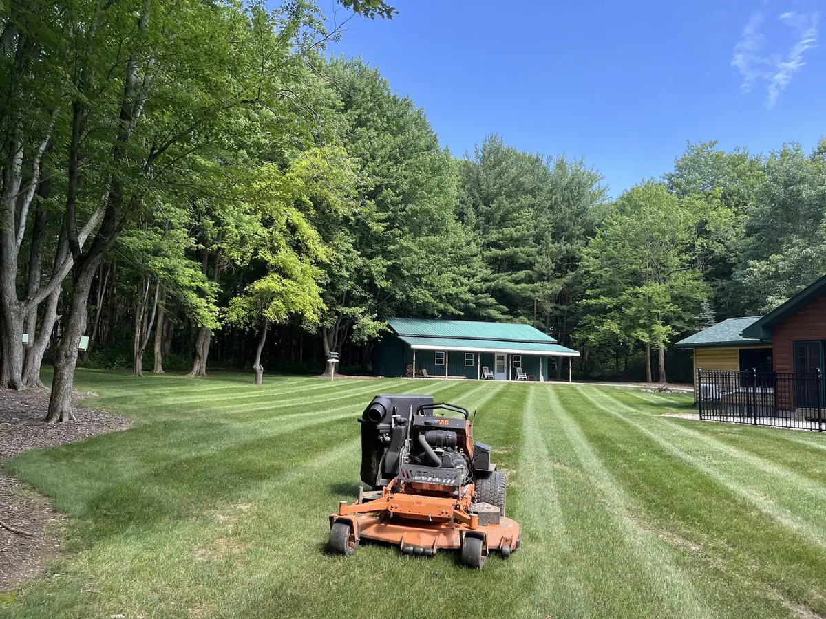 Zero turn mower on freshly cut lawn